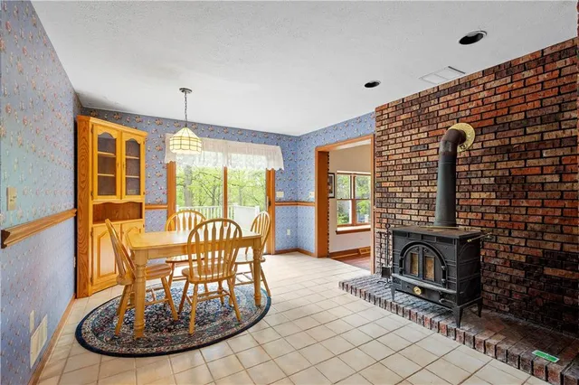 a view of a dining room with furniture window and outside view