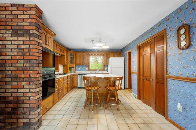 a kitchen with a sink cabinets and window