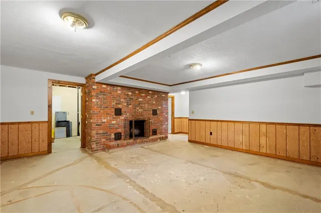 an empty room with a fireplace