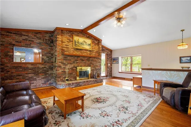 a view of a livingroom with furniture and window