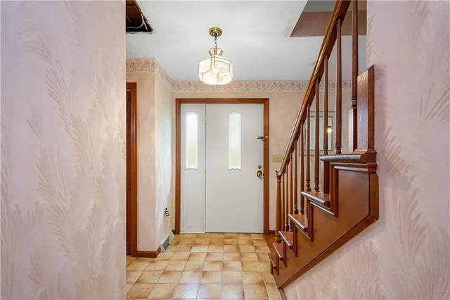 a view of an entryway with wooden floor