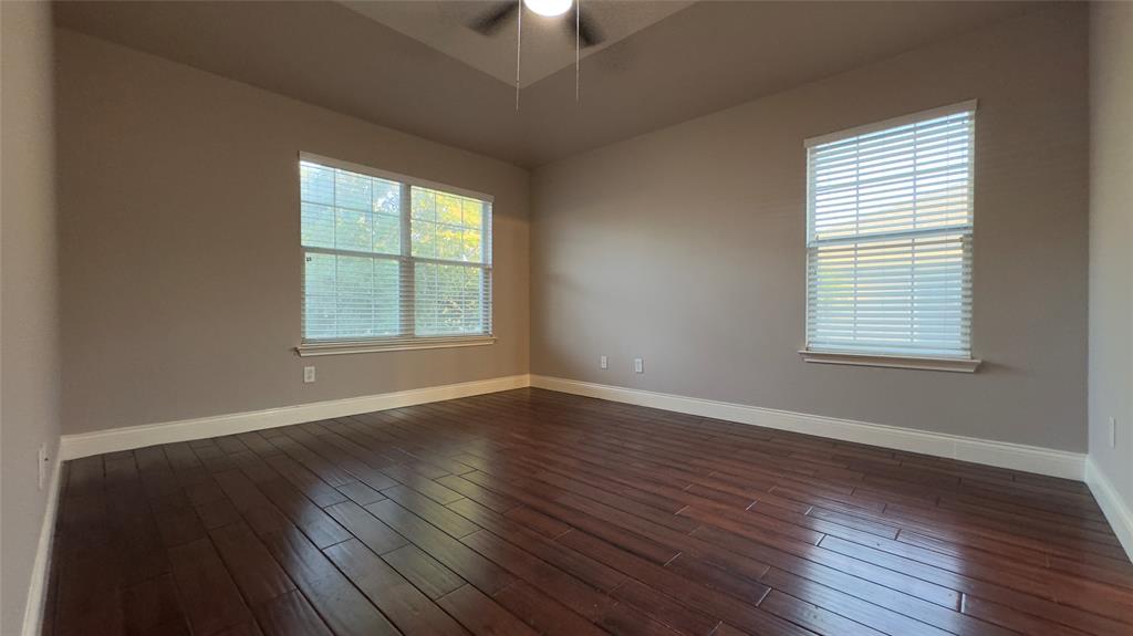 1900 Scofield Ridge Parkway, Unit 5501 Austin, TX 78727 - Photo 5 of 21 Rich hardwood flooring complements the naturally illuminated walls of this versatile space.