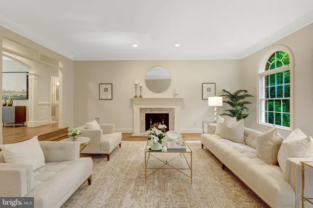 a living room with fireplace furniture and a fireplace