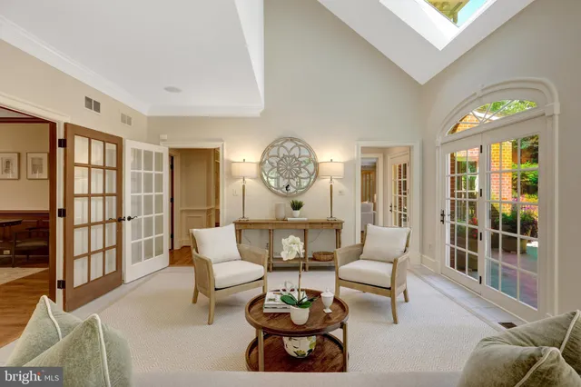 a kitchen with granite countertop a sink and a refrigerator