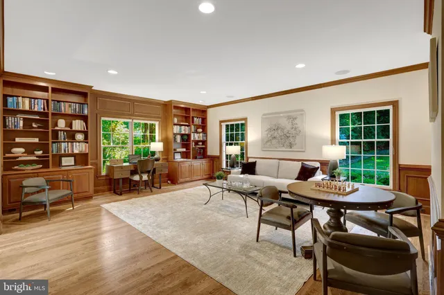 a kitchen with granite countertop a stove a sink and a refrigerator