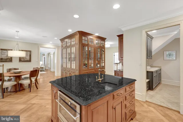 a view of a patio with a table chairs and wooden floor