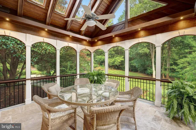 a bathroom with a granite countertop sink and a window