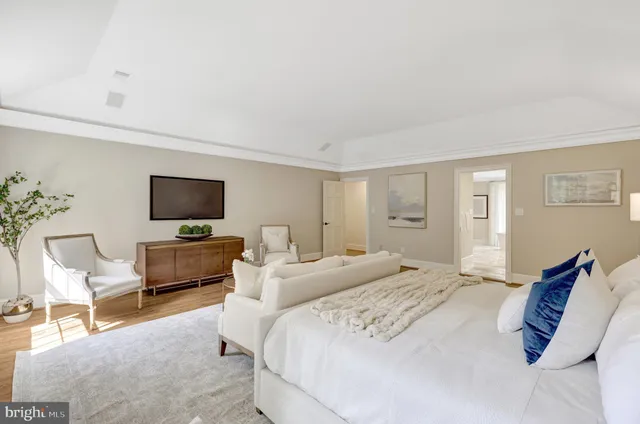 a bathroom with a double vanity sink mirror and a bathtub