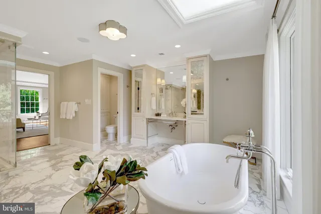 a view of a patio with couches table and chairs and potted plants