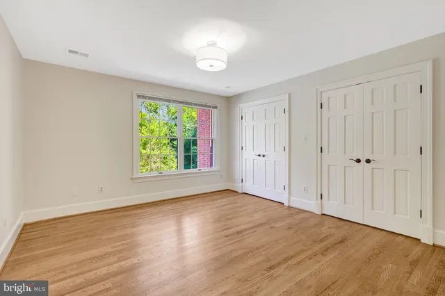 a view of a patio with couches table and chairs and potted plants