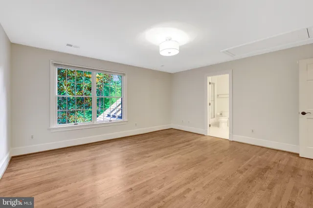 a view of a big yard with large trees