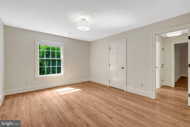 a view of a garden with a building in the background