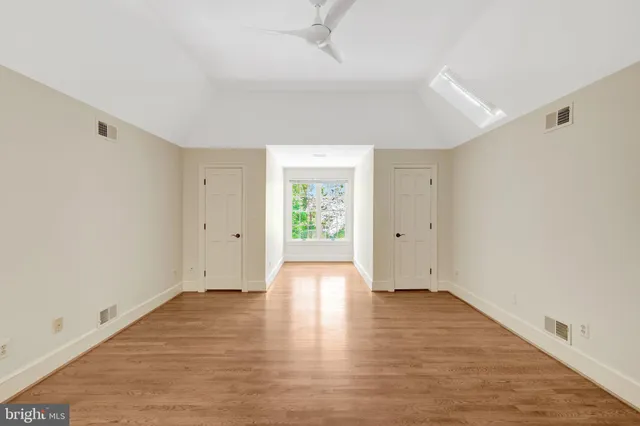 a view of a big yard with trees in the background