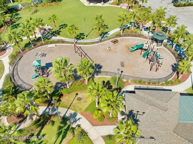 a view of swimming pool with a table and chairs