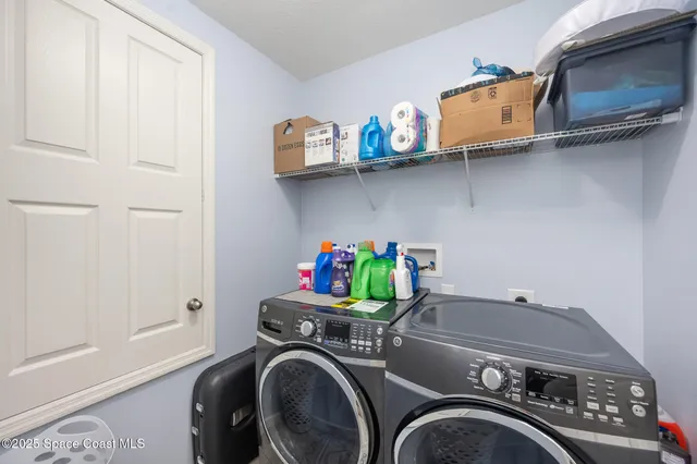 a utility room with dryer and washer