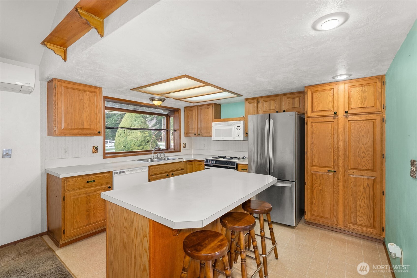 141 East Deer Creek Road Shelton, WA 98584 - Photo 13 of 40 a kitchen with stainless steel appliances a stove a refrigerator and a refrigerator