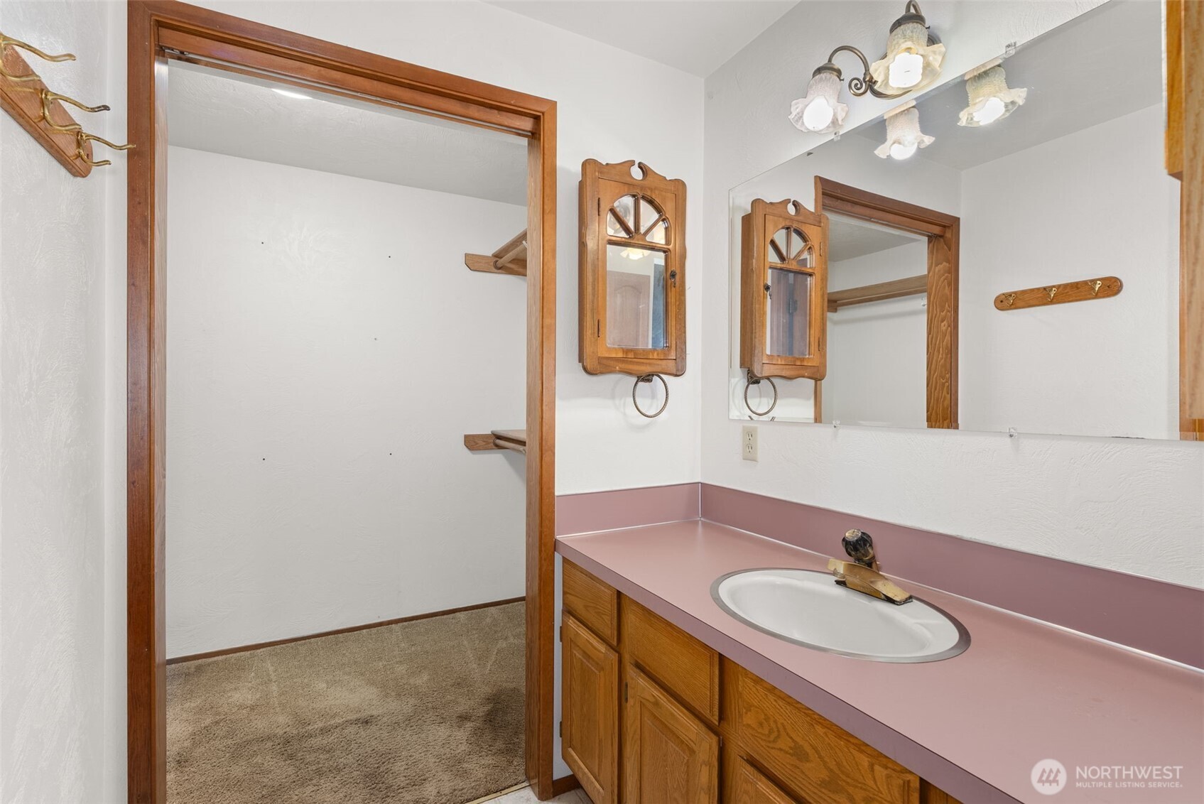 141 East Deer Creek Road Shelton, WA 98584 - Photo 18 of 40 a bathroom with a granite countertop sink a mirror and a shower