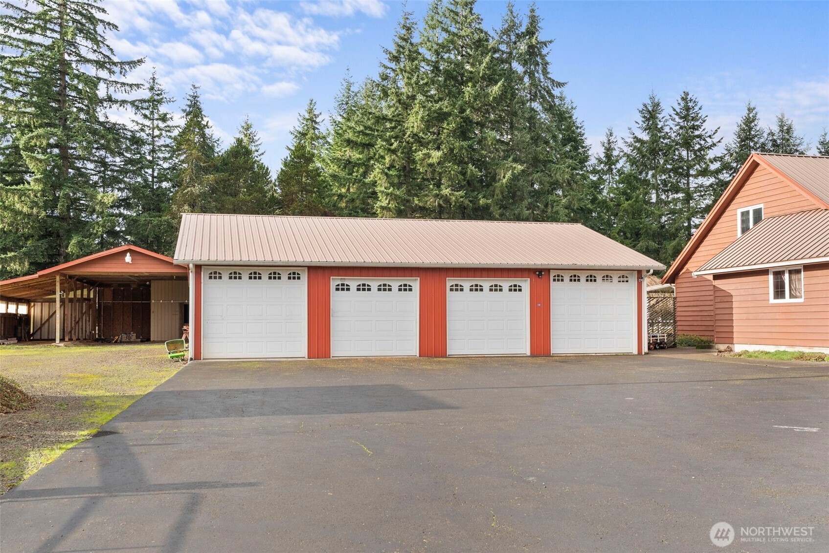 141 East Deer Creek Road Shelton, WA 98584 - Photo 27 of 40 a front view of a house with a garage