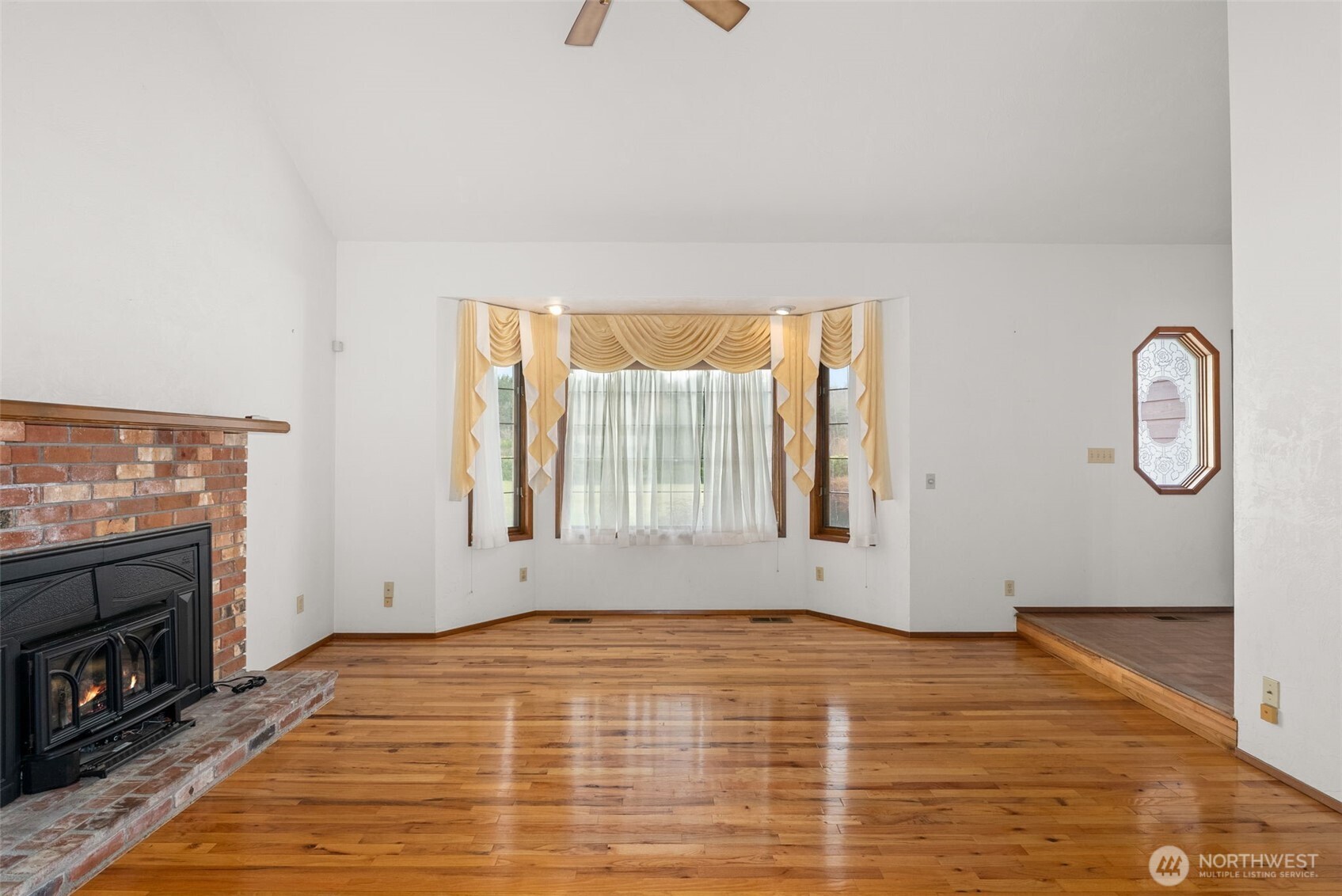 141 East Deer Creek Road Shelton, WA 98584 - Photo 8 of 40 a view of empty room with window and fireplace