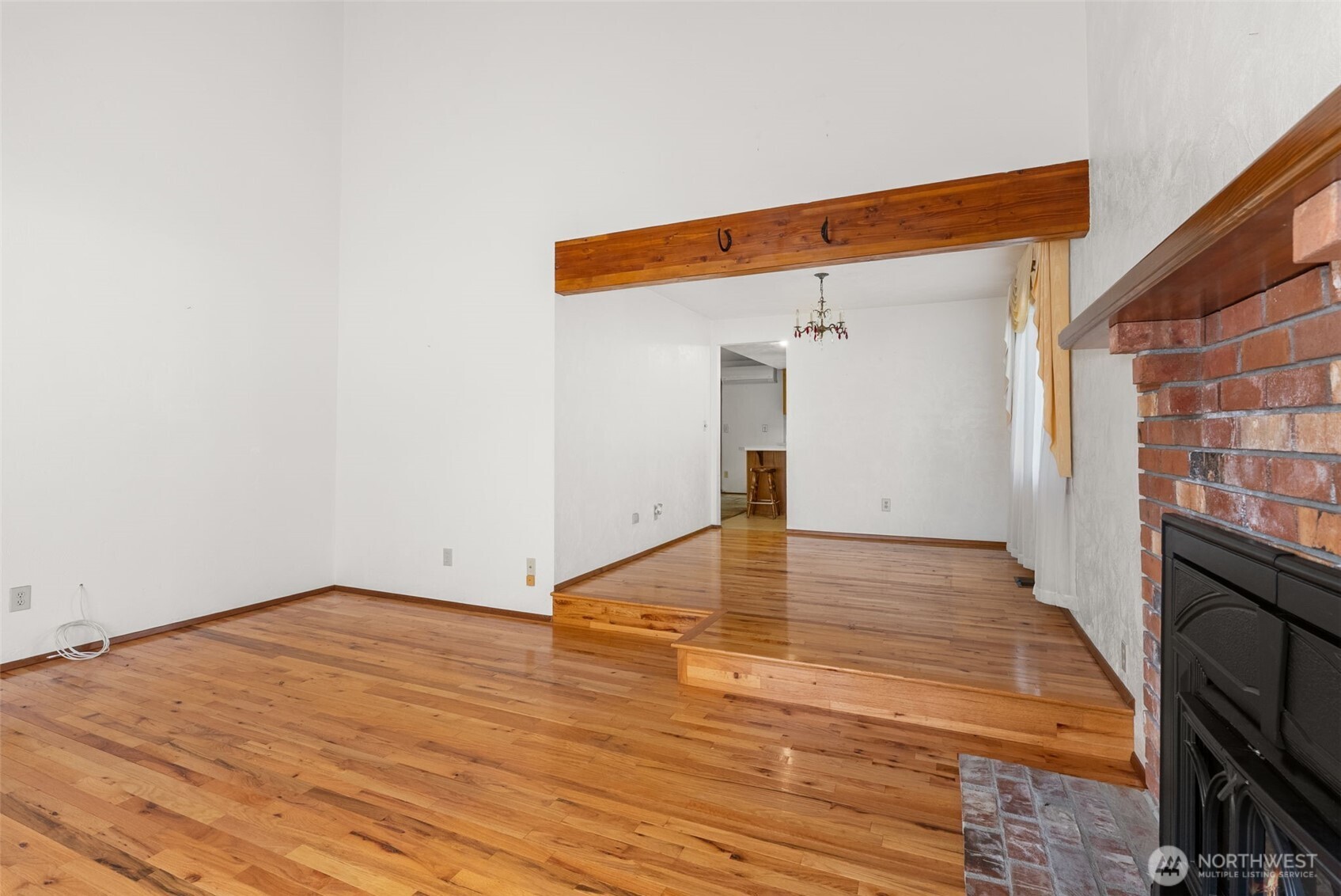 141 East Deer Creek Road Shelton, WA 98584 - Photo 9 of 40 a view of empty room with wooden floor and fan