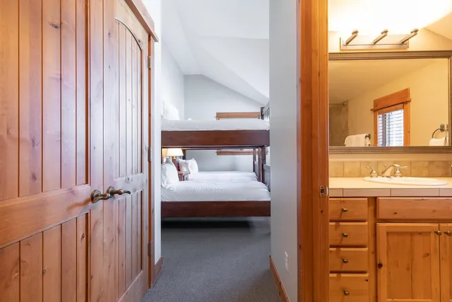 a view of bedroom with a bed and wooden floor
