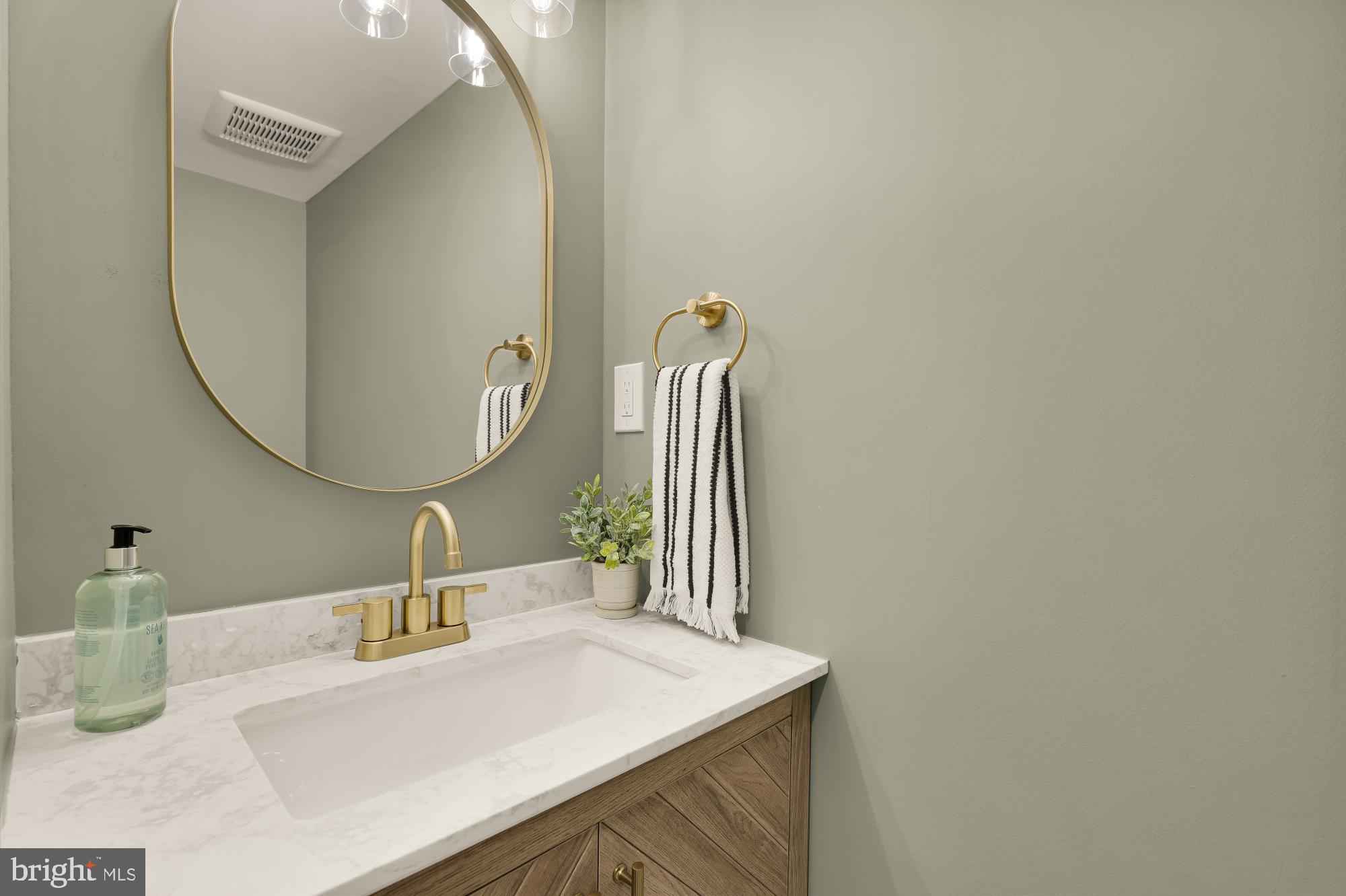 9532 Burdett Road Burke, VA 22015 - Photo 15 of 35 a bathroom with a sink and a mirror