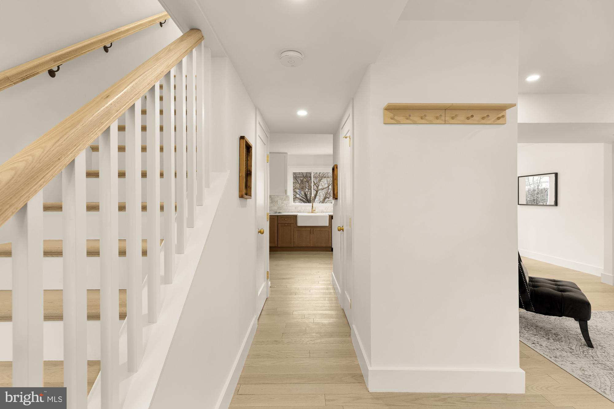 9532 Burdett Road Burke, VA 22015 - Photo 2 of 35 a view of a hallway with white walls and stairs
