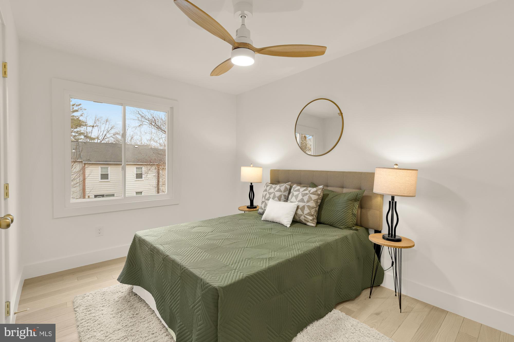 9532 Burdett Road Burke, VA 22015 - Photo 21 of 35 a bedroom with a bed and a painting on the wall