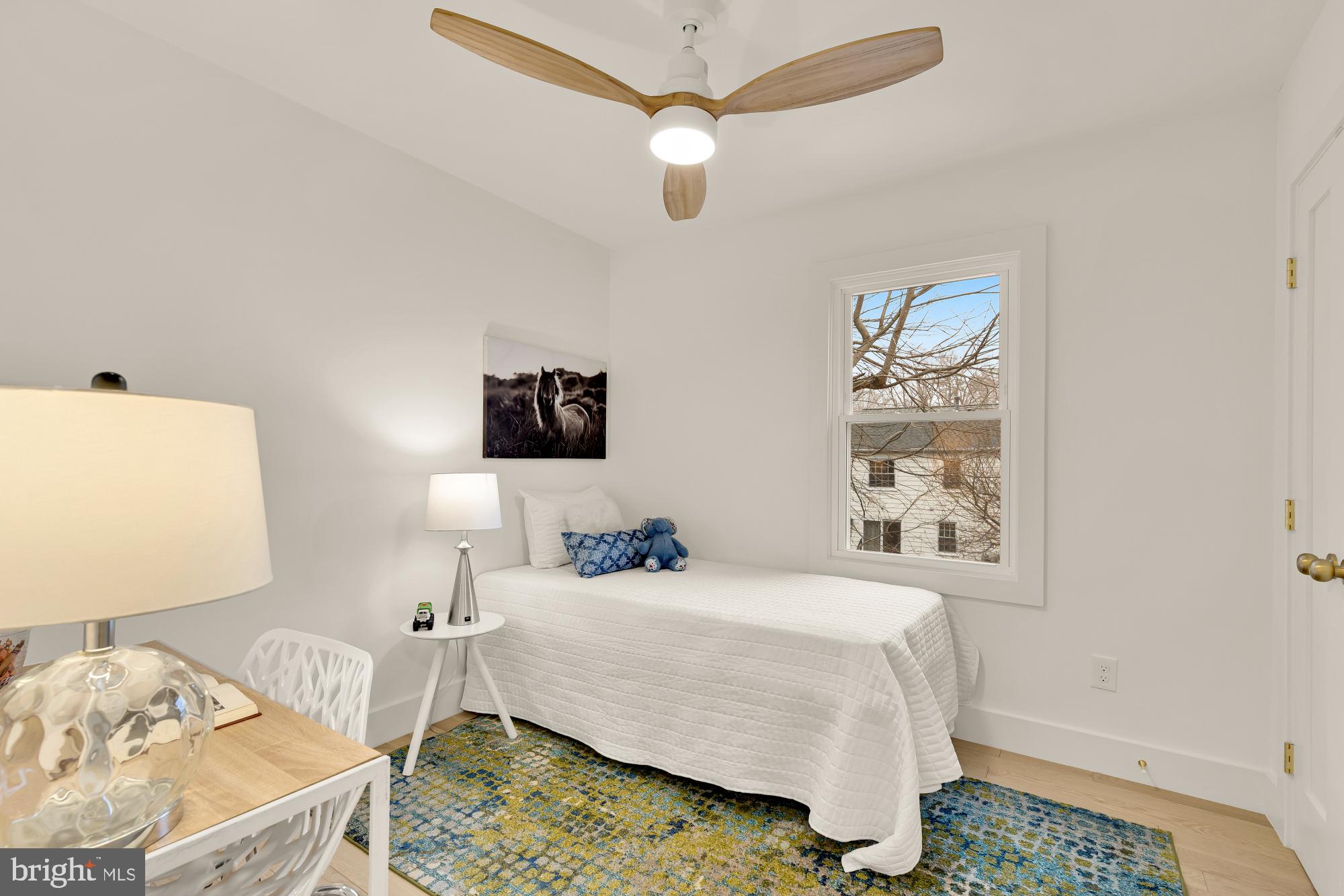 9532 Burdett Road Burke, VA 22015 - Photo 23 of 35 a bedroom with a bed and a table in it