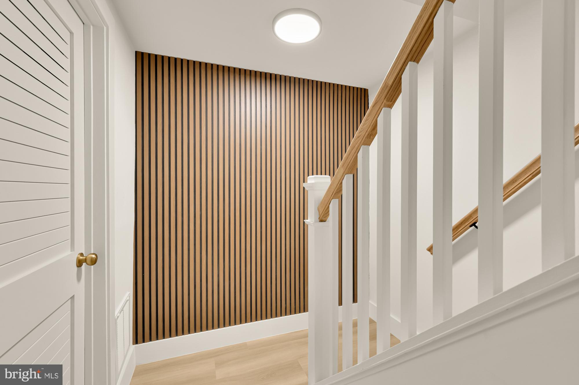 9532 Burdett Road Burke, VA 22015 - Photo 26 of 35 a view of a livingroom with a staircase