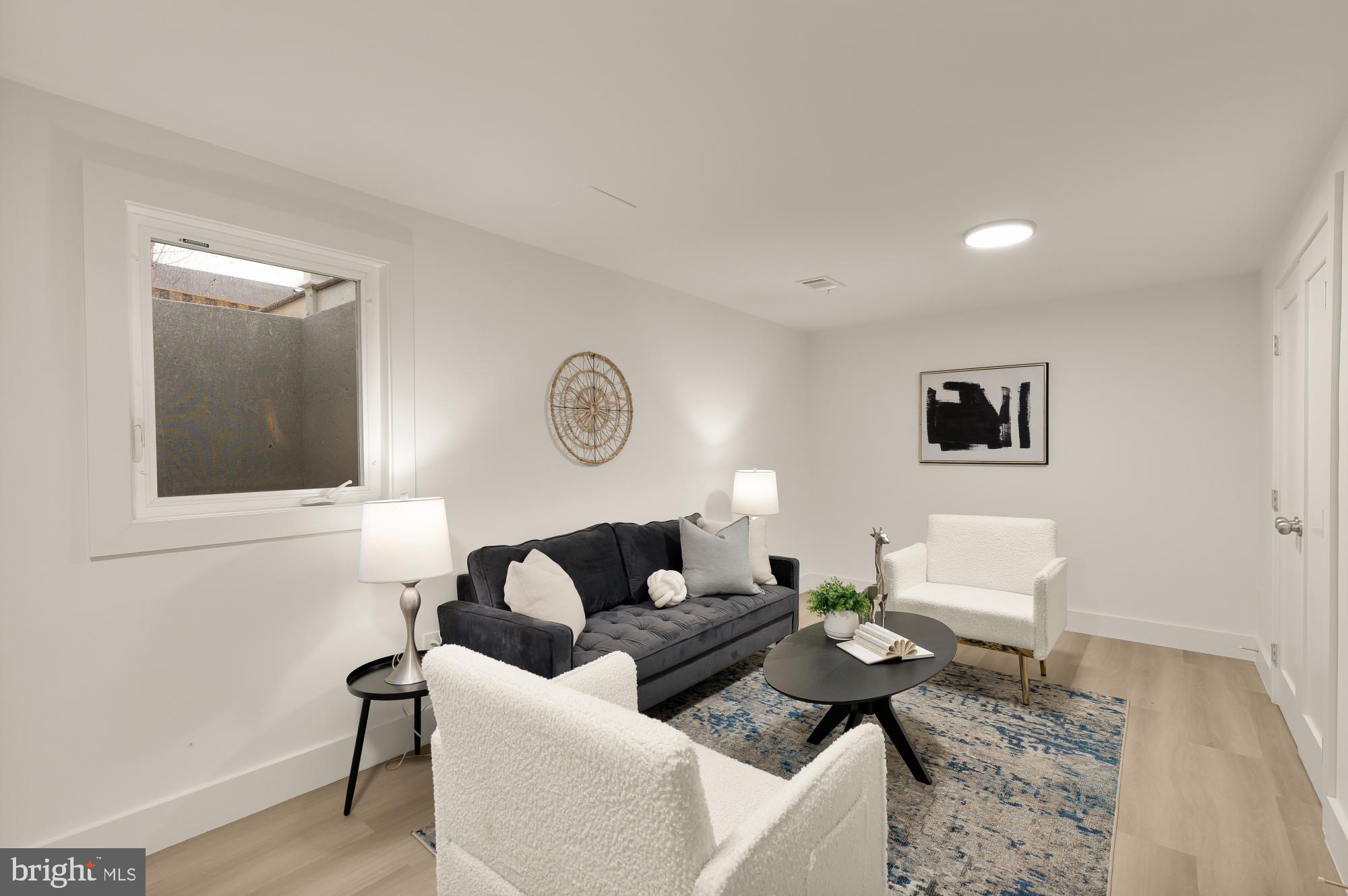 9532 Burdett Road Burke, VA 22015 - Photo 27 of 35 a living room with furniture and a wooden floor