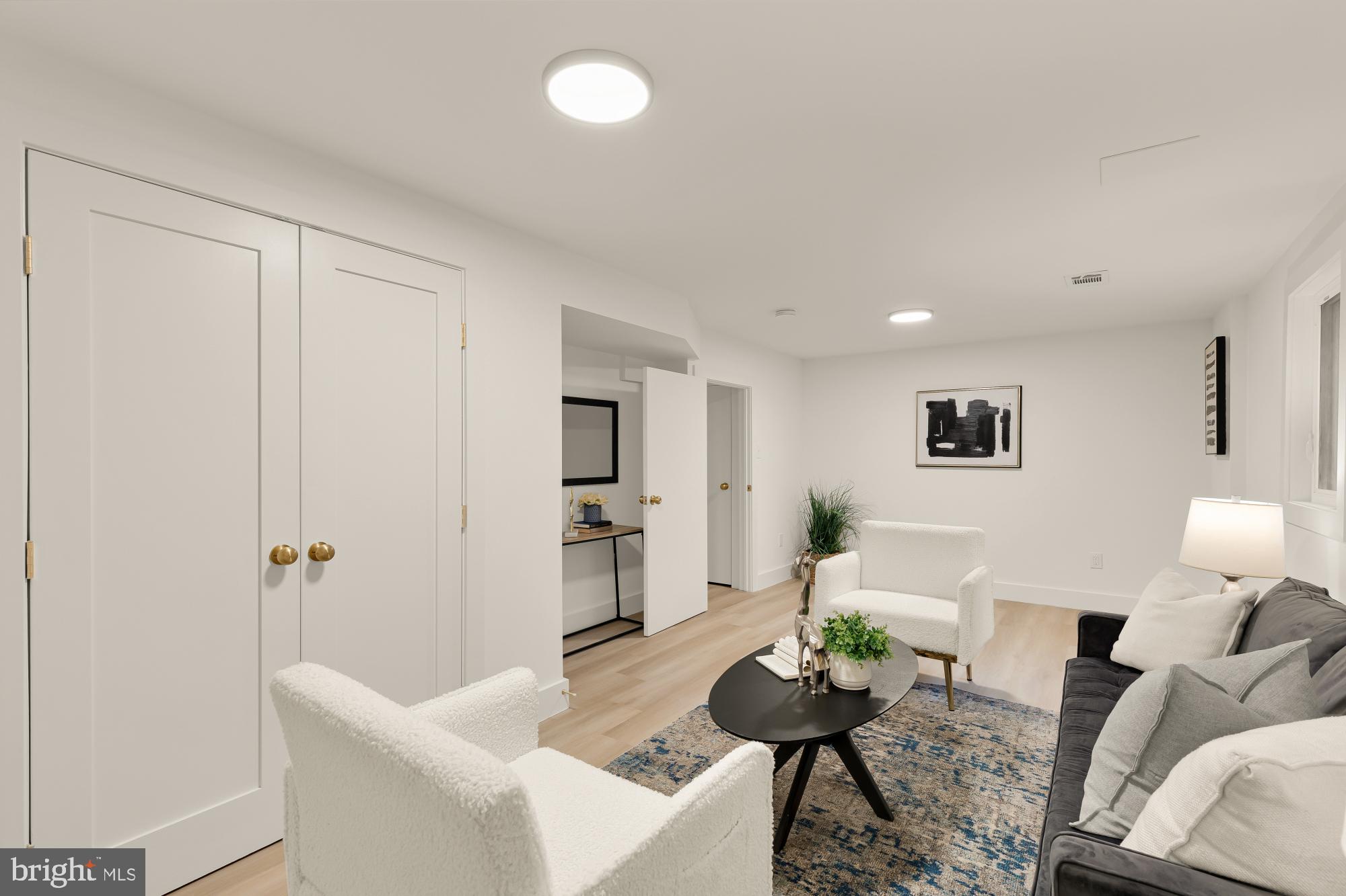 9532 Burdett Road Burke, VA 22015 - Photo 29 of 35 a living room with furniture and wooden floor