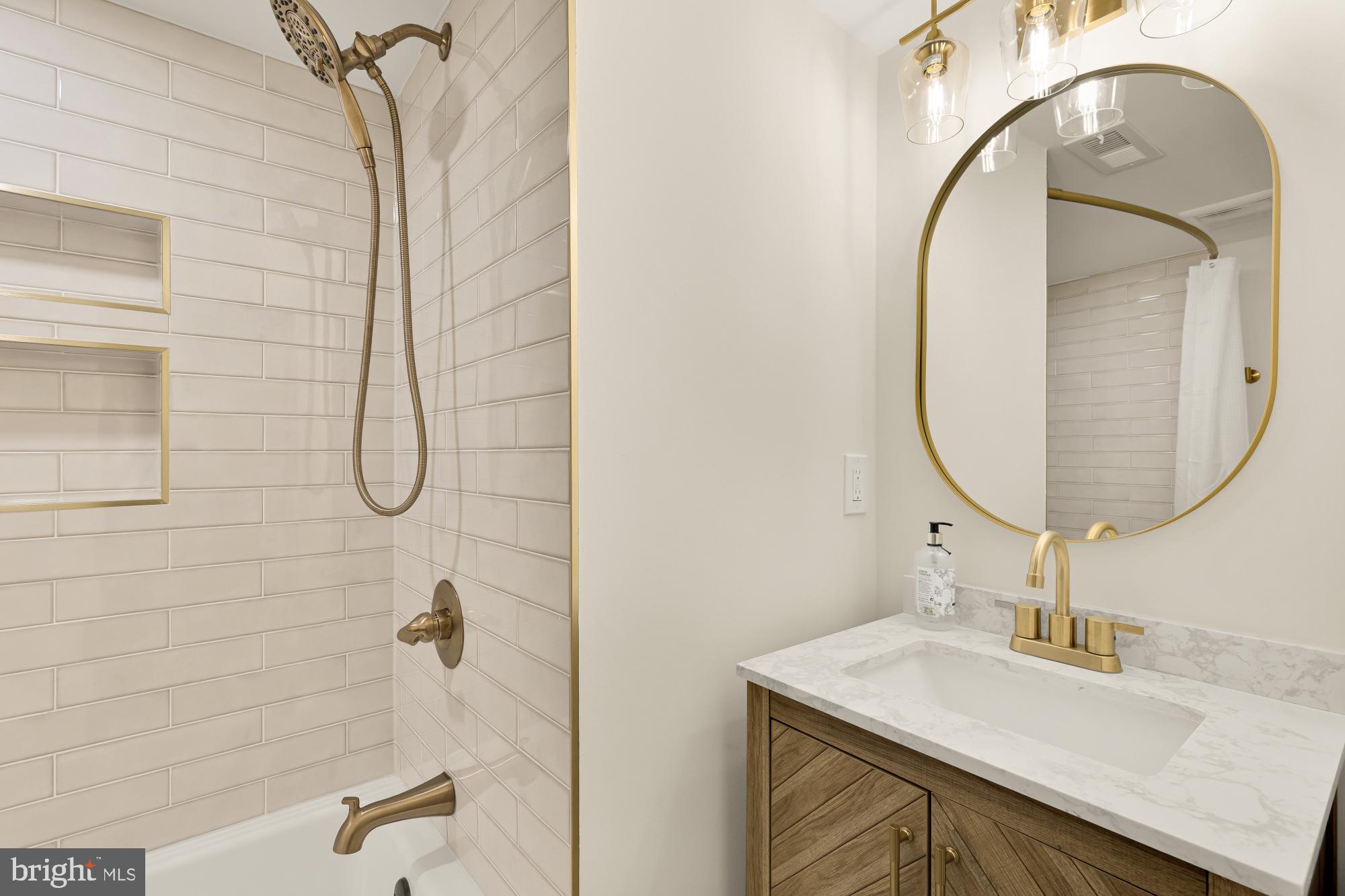 9532 Burdett Road Burke, VA 22015 - Photo 30 of 35 a bathroom with a sink and a mirror