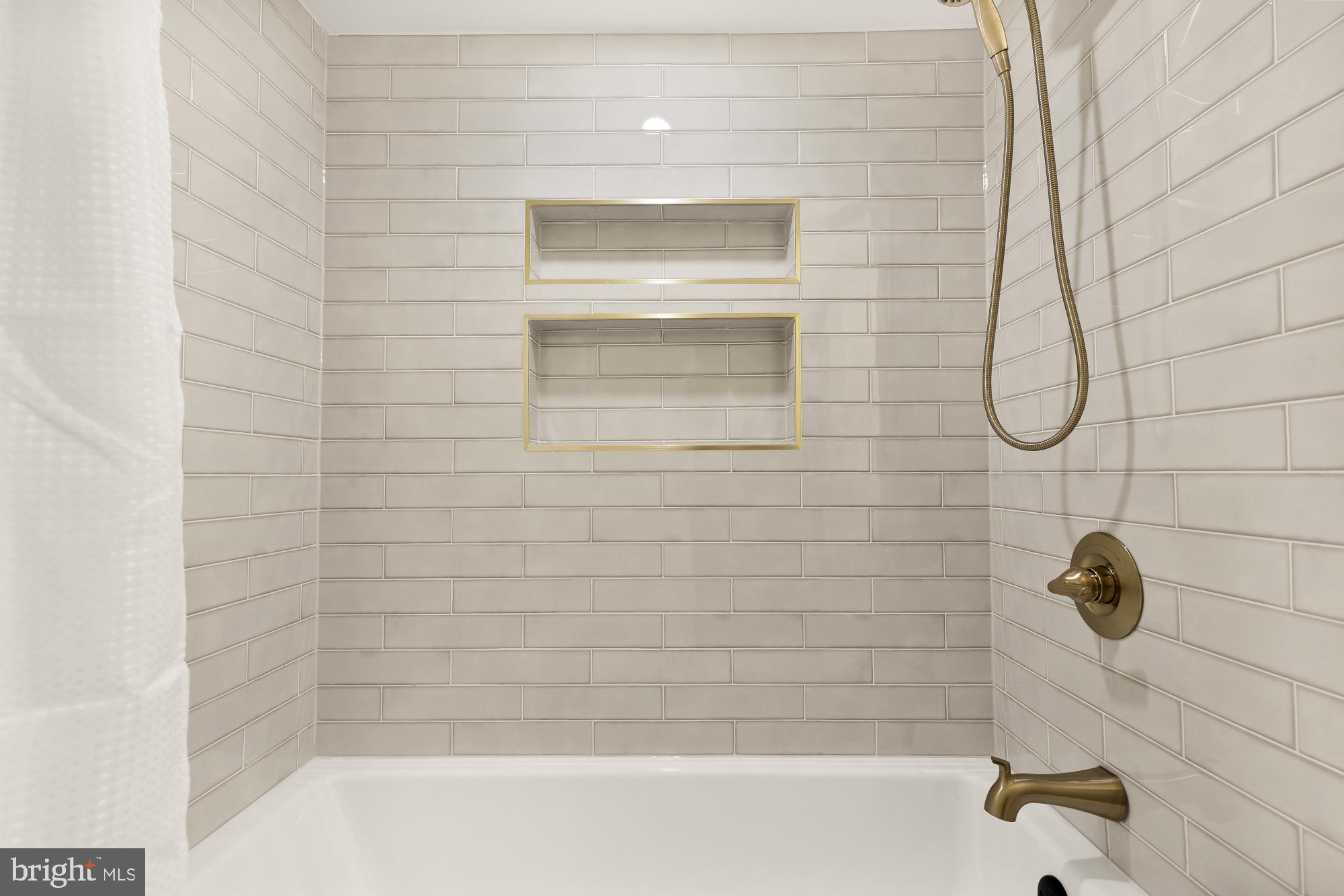 9532 Burdett Road Burke, VA 22015 - Photo 31 of 35 a bathroom with a shower