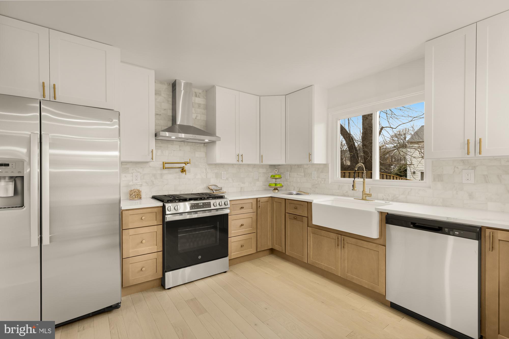 9532 Burdett Road Burke, VA 22015 - Photo 10 of 35 a kitchen with cabinets stainless steel appliances and a sink