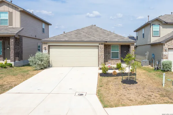 a view of a backyard with sitting area and furniture
