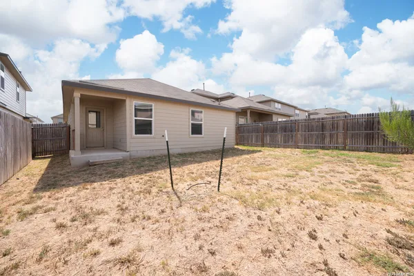 a house view with a backyard space