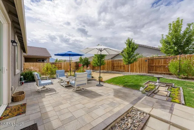 a front view of house with yard and outdoor seating
