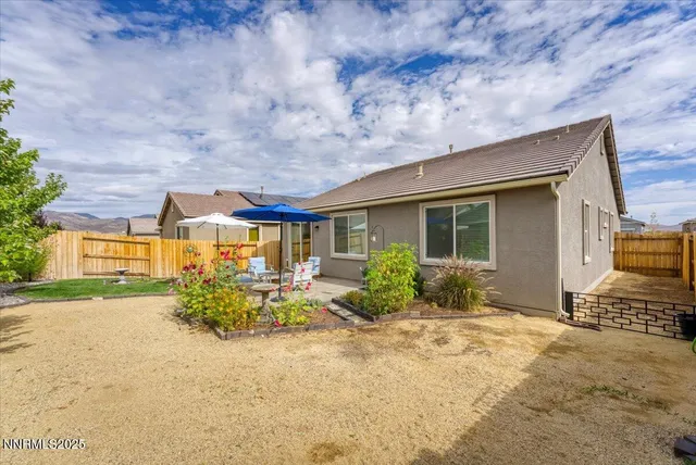 a view of a garden with plants and trees