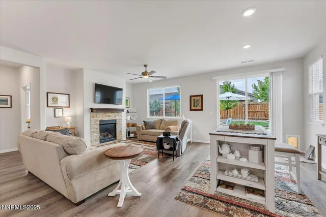 a kitchen with stainless steel appliances granite countertop wooden cabinets a stove a sink and a refrigerator