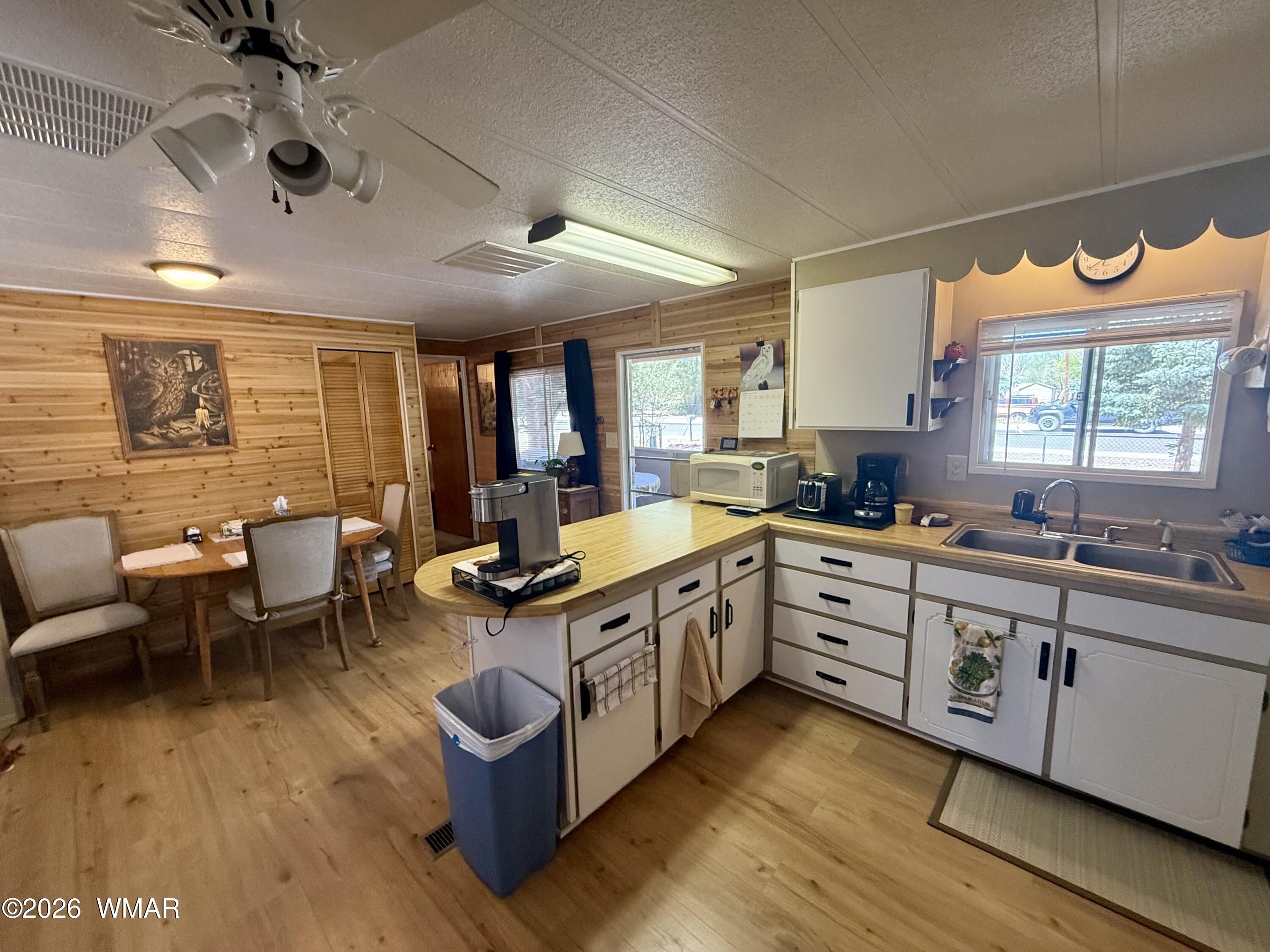 727 South Butler Street Eagar, AZ 85925 - Photo 4 of 32 a open kitchen with stainless steel appliances granite countertop a stove and cabinets