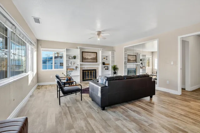 a living room with furniture and a fireplace
