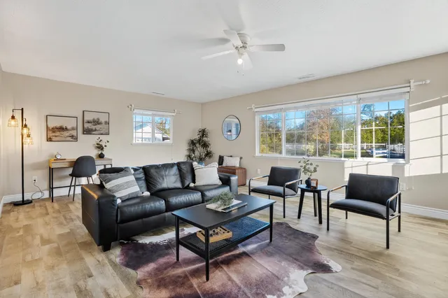 a living room with furniture and a large window