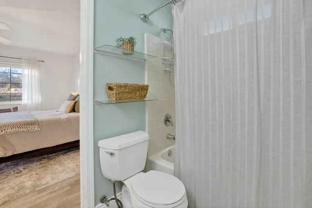 a bathroom with a toilet and a sink