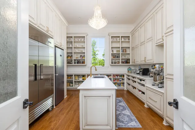 a bathroom with bathtub and windows