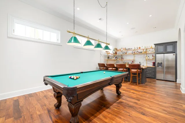 a kitchen with a stove a sink and a wooden cabinets