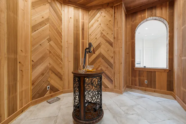 a view of a kitchen with a sink and a mirror