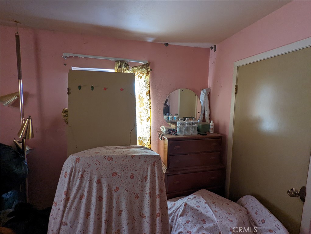 4175 Ferrand Road Lucerne, CA 95458 - Photo 29 of 44 a bedroom with a bed and a dresser in it