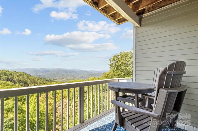 a view of a balcony with furniture