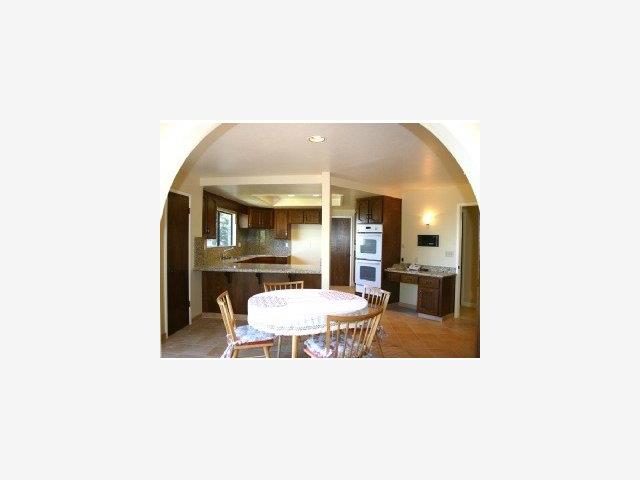 22330 Regnart Road Cupertino, CA 95014 - Photo 5 of 9 a balcony with table and chairs